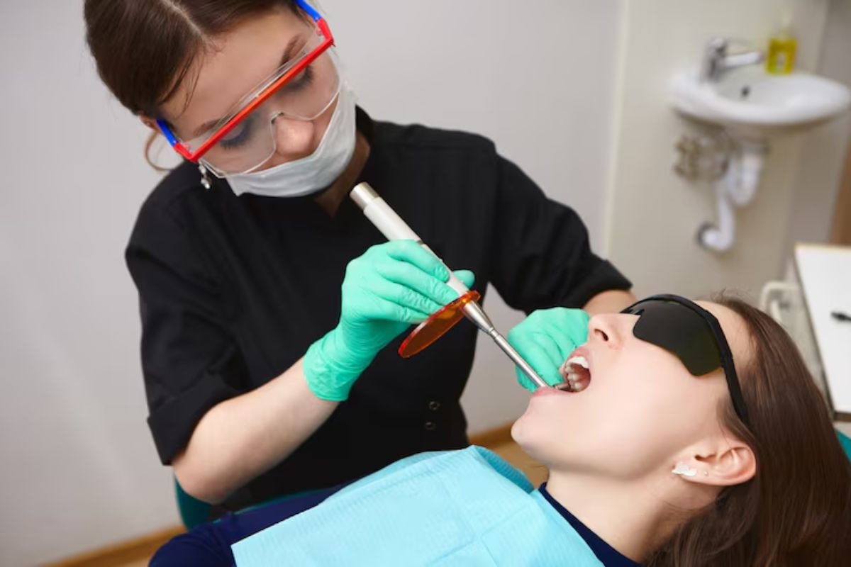 patient receiving dental sealant treatment to protect teeth and improve oral health.